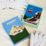 Two bags titled 'Big Sky' and 'Jackson Hole' with white gloves on a light background